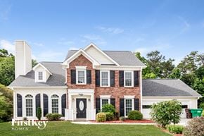 High Point house for rent - a brick house with black shutters and white trim