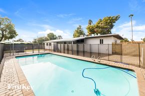 Phoenix house for rent - A pool with a blue hose attached to it.