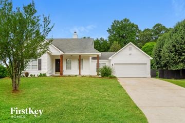 Winder house for rent - a white house with a lawn and a driveway