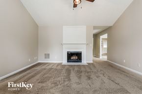 Winder house for rent - the living room has a fireplace and carpeted flooring