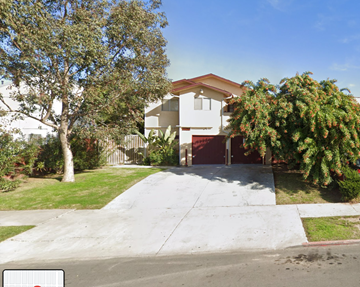 San Diego apartment for rent - the front of a house with a driveway and trees
