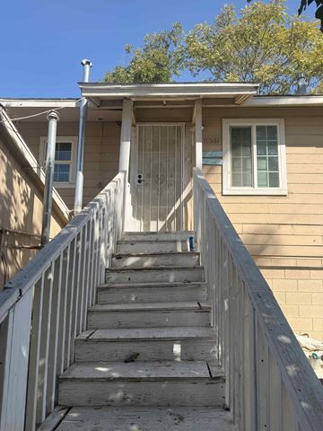 Bakersfield apartment for rent - A staircase leading to a house with a white railing.