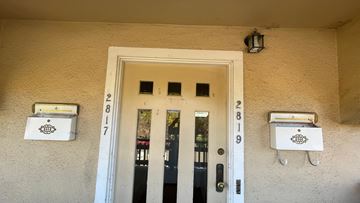 Berkeley apartment for rent - the front door of an apartment building with mailboxes on the side