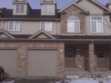 Guelph apartment for rent - a house with a garage door in front of it