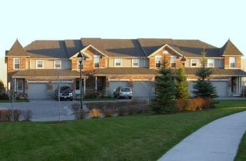 Guelph apartment for rent - a large house with a driveway in front of it