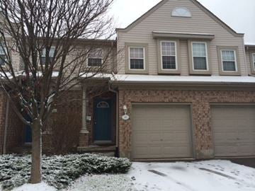 Guelph apartment for rent - a house with two garage doors in the snow
