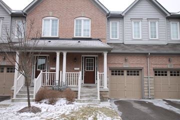 Guelph apartment for rent - the front of a house with snow on the ground