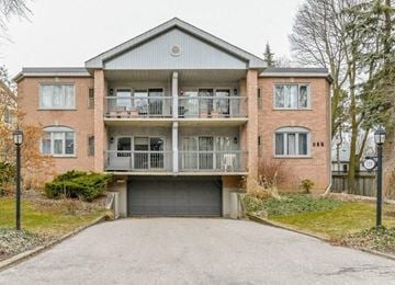 Guelph apartment for rent - A two-story brick house with a balcony on the second floor.