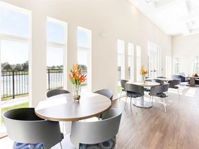 Spring Hill apartment for rent - a dining room with tables and chairs and large windows