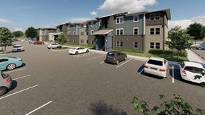Bradenton apartment for rent - a parking lot with cars in front of an apartment building