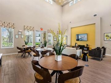 Dade City apartment for rent - a living room with a table and chairs