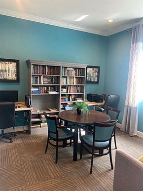 Lake Worth apartment for rent - A room with a table, chairs, and a bookshelf.