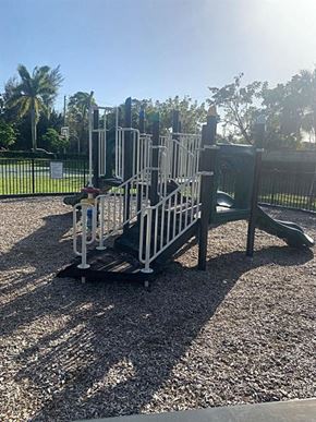 Lake Worth apartment for rent - A playground with a slide and a climbing frame.