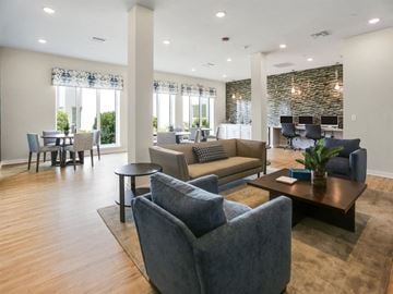 Bradenton apartment for rent - a living room with couches and chairs and a table