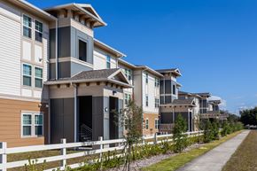 Eustis apartment for rent - a row of town houses with a sidewalk in front of them