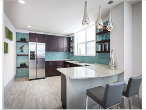 Fort Lauderdale apartment for rent - a kitchen with a large island and a stainless steel refrigerator