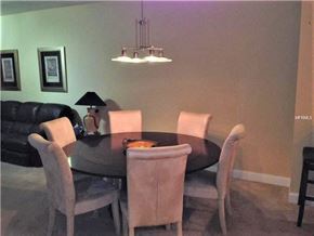 Palmetto house for rent - a dining room with a table and chairs