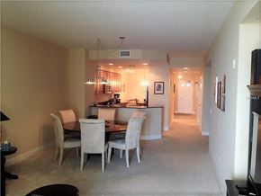 Palmetto house for rent - a dining room and kitchen with a table and chairs