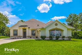 Jacksonville house for rent - a house with a lawn and a blue sky