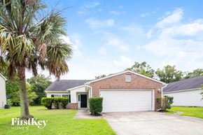 North Charleston house for rent - a house with a palm tree in front of it