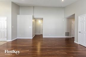 Plainfield house for rent - an empty living room with wood floors and white walls