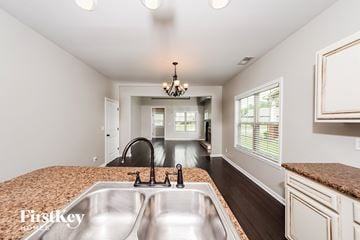 Odenville house for rent - A kitchen with a sink and a chandelier.