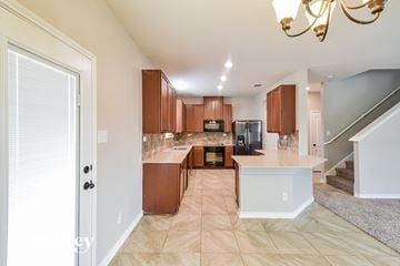 San Antonio house for rent - a kitchen with wooden cabinets and a white counter top
