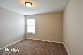 San Antonio house for rent - the upstairs bedroom with carpet and a window