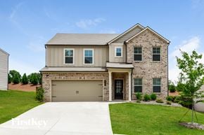 Flowery Branch house for rent - a large house with a garage door in front of it