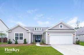 Moncks Corner house for rent - a beige and white house with a garage door