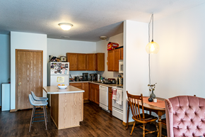 Ames apartment for rent - A kitchen with a table and chairs.