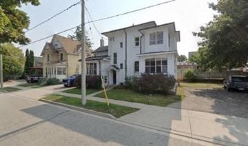 Kitchener apartment for rent - a white house on the corner of a street