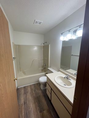 Rothschild apartment for rent - A bathroom with a toilet, sink, and shower.