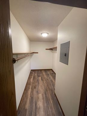 Rothschild apartment for rent - A long hallway with wood floors and white walls.