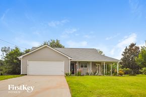 Covington house for rent - a house with a lawn and a driveway