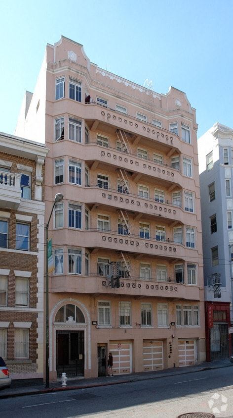 San Francisco apartment for rent - A pink building with many windows and balconies.