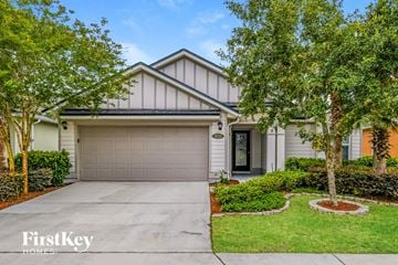 Jacksonville house for rent - a home with a driveway and a garage door