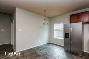 Grand Prairie house for rent - a kitchen with a stainless steel refrigerator and a window