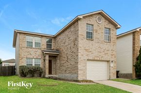 San Antonio house for rent - a brick house with a white garage door