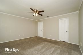 San Antonio house for rent - the living room of a house with a ceiling fan
