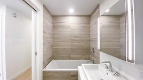 Vancouver apartment for rent - A bathroom with a white sink and a bathtub.