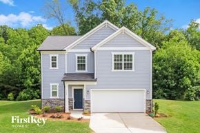 Winston-Salem house for rent - a blue house with a white garage door