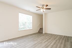 Winston-Salem house for rent - a living room with hardwood floors and a ceiling fan