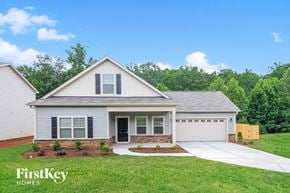 Winston-Salem house for rent - a white house with a lawn and a driveway