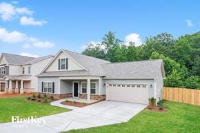 Winston-Salem house for rent - a white house with a lawn and a driveway