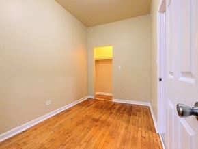 Chicago apartment for rent - an empty room with a hard wood floor and a closet