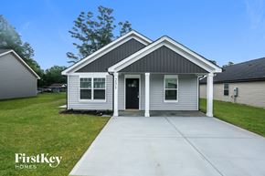Kannapolis house for rent - a white house with a sidewalk in front of it