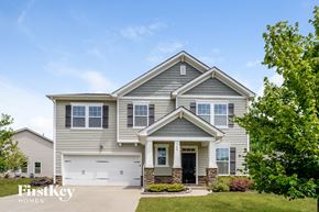 Belmont house for rent - a gray house with a white garage door