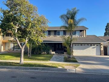 Cerritos apartment for rent - a house with a palm tree in front of it