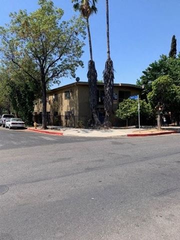 North Hollywood apartment for rent - a building on the corner of a street with palm trees